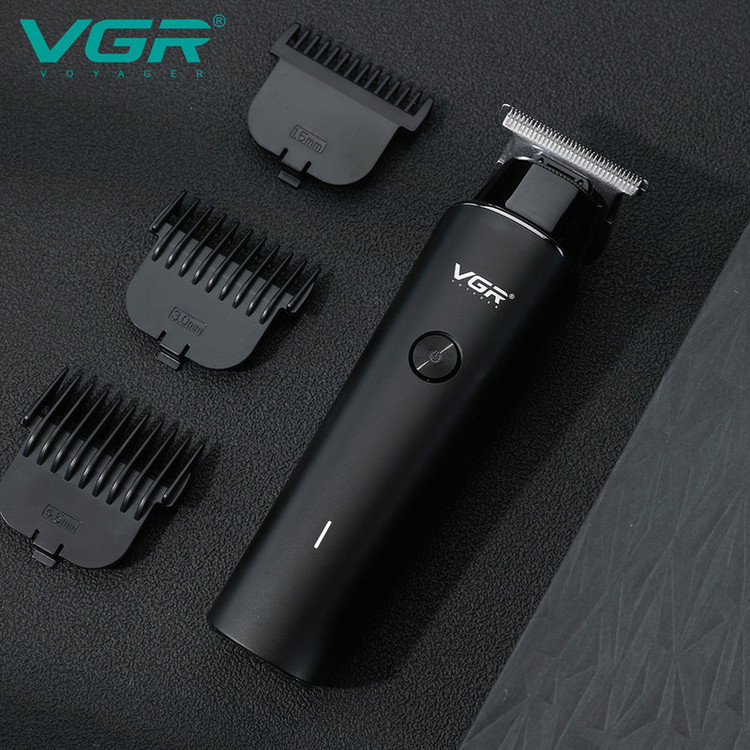 ماشین اصلاح موی سر و صورت وی جی ار مدل V-933 با تیغه استیل پیشرفته، اصلاح خط زن و حجم زن، قابلیت استفاده خشک و مرطوب، باتری قابل شارژ با 500 دقیقه کارکرد و چهار شانه تنظیم اندازه اصلاح 0.5 تا 2 میلیمتر