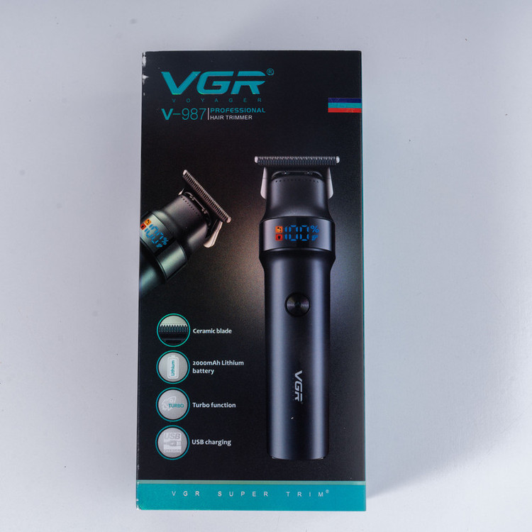 ماشین اصلاح موی سر و صورت وی جی آر مدل V-987 با تیغه سرامیکی و استیل ضد زنگ، موتور دی سی 7000 دور در دقیقه، عملکرد توربو، باتری 2000 میلیآمپرساعتی با 400 دقیقه استفاده و صفحه نمایش الایدی میزان شارژ