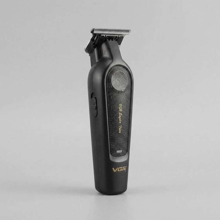 ماشین اصلاح موی سر و صورت وی جی آر مدل V-995 با تیغه کربن استیل، باتری لیتیوم یون 2000 میلیآمپر ساعت، شارژ USB، قابلیت تنظیم سرعت و طراحی ارگونومیک و سبک