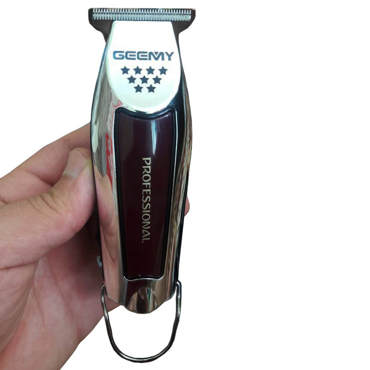 ماشین اصلاح موی سر و صورت جیمی مدل GM 855 با تیغه استیل ضد زنگ، باتری لیتیوم یون، دو سرعت موتور قابل تنظیم، منبع تغذیه برق و باتری قابل شارژ، همراه با 3 عدد شانه متحرک و طراحی ارگونومیک