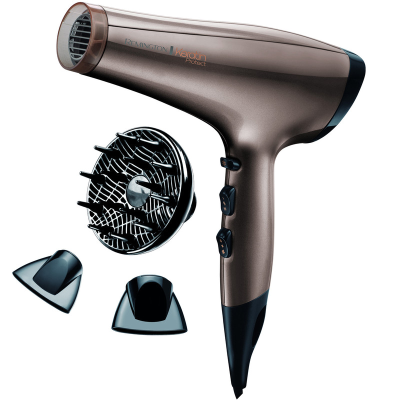 سشوار رمینگتون مدل AC8002 Keratin Protect با موتور AC، توان 2200 وات، فناوری تولید یون، محافظت از کراتین مو، تنظیم دما در 3 حالت، تنظیم سرعت در 2 حالت، باد سرد، کابل 1.8 متری، همراه با 3 سری مختلف، مناسب استفاده خانگی و نیمه‌حرفه‌ای